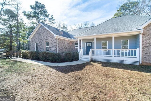 4801 Daniel Mill Rd, Winston, GA 30187 - ranch-style home with fence, covered porch, a front yard, and brick siding