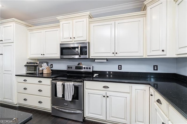4801 Daniel Mill Rd, Winston, GA 30187 - kitchen featuring dark stone countertops, a toaster, stainless steel appliances, dark wood-style floors, and crown molding