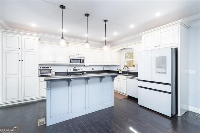 4801 Daniel Mill Rd, Winston, GA 30187 - kitchen with dark wood-style floors, dark countertops, appliances with stainless steel finishes, and white cabinetry