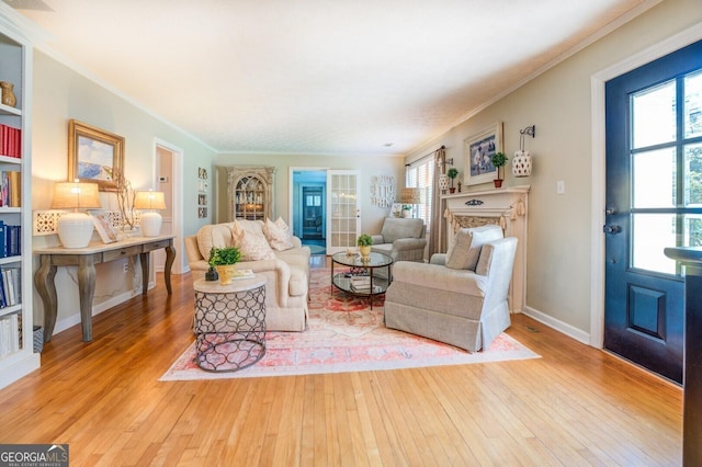 living room with hardwood / wood-style flooring and ornamental molding