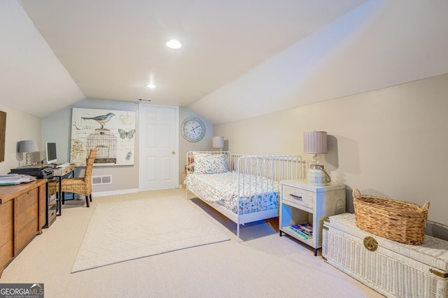 bedroom featuring light colored carpet and lofted ceiling