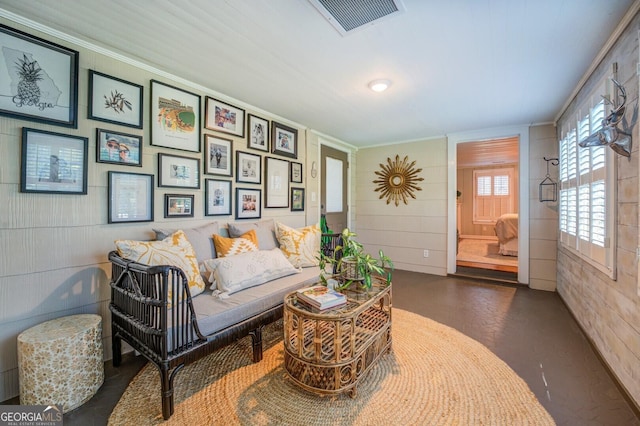 living room with ornamental molding