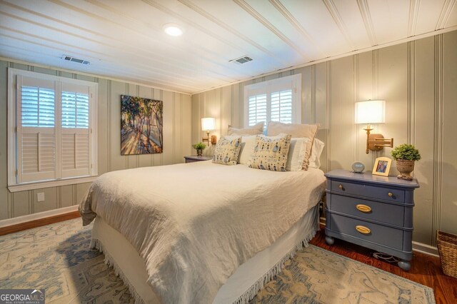 bedroom featuring dark hardwood / wood-style flooring