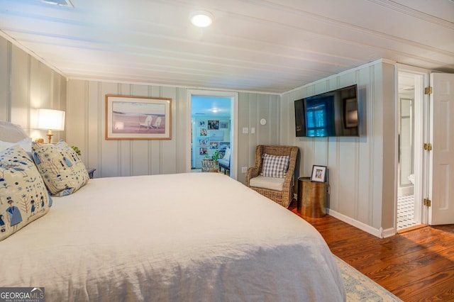 bedroom with dark wood-type flooring