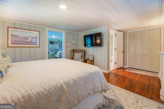 bedroom featuring hardwood / wood-style flooring and ornamental molding