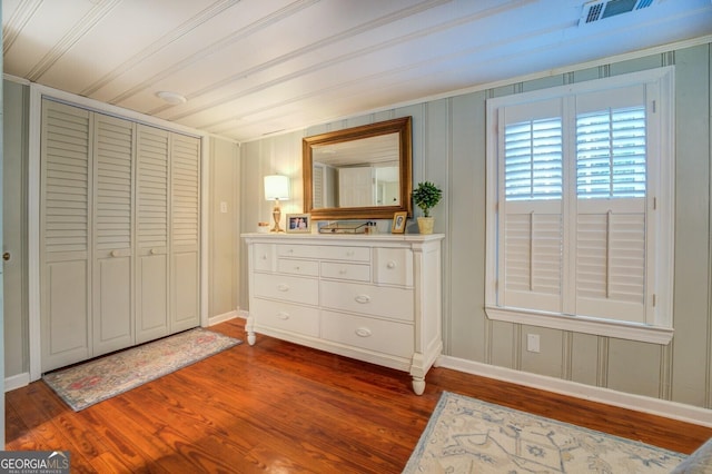 bedroom featuring hardwood / wood-style floors and a closet