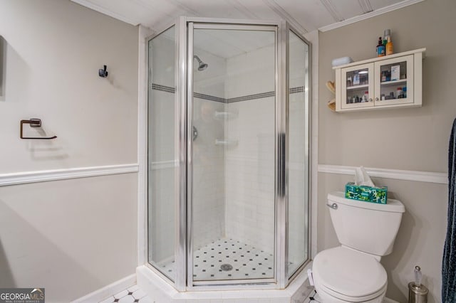 bathroom with walk in shower, ornamental molding, and toilet