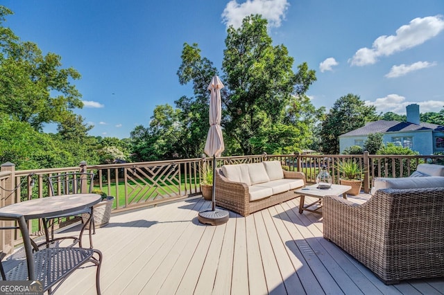 deck featuring outdoor lounge area