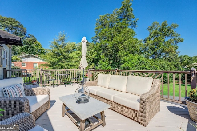 wooden deck featuring an outdoor hangout area