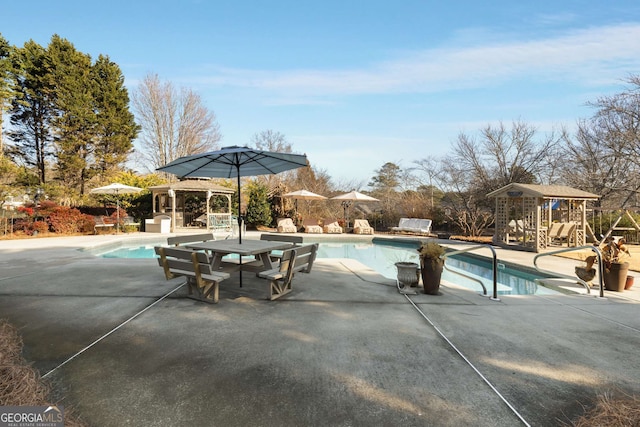 view of swimming pool with a gazebo and a patio area