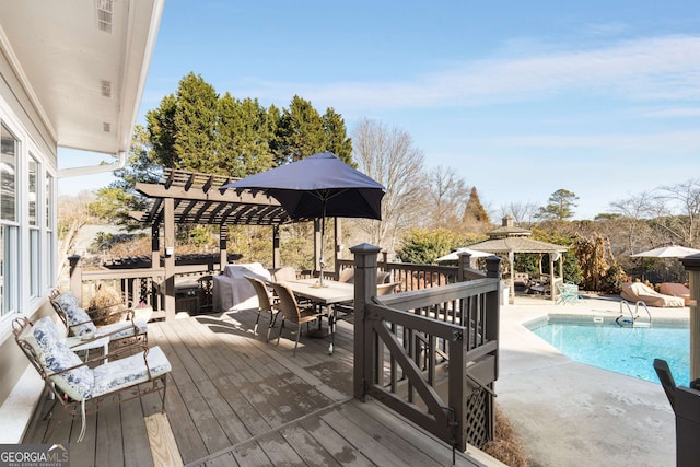 wooden deck featuring a pergola, outdoor lounge area, and a gazebo