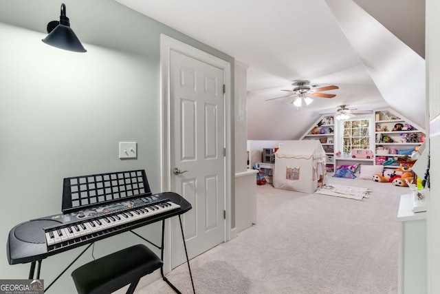 playroom featuring lofted ceiling and carpet floors