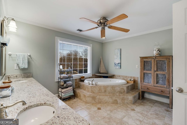 bathroom featuring vanity, a relaxing tiled tub, ornamental molding, and ceiling fan