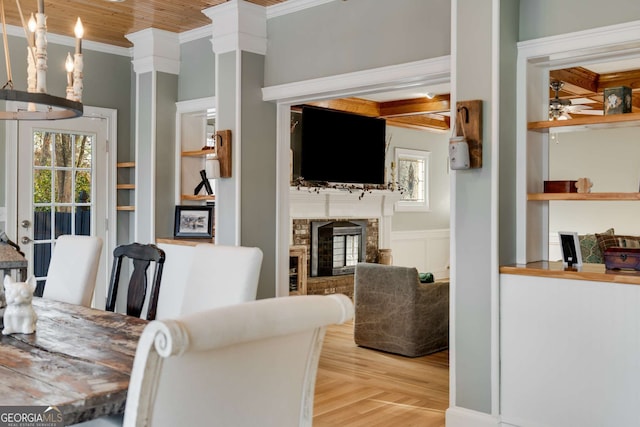 dining area with ceiling fan, ornamental molding, light hardwood / wood-style flooring, and wooden ceiling