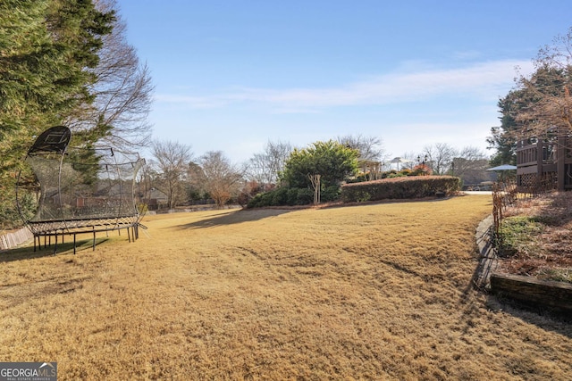 view of yard with a trampoline