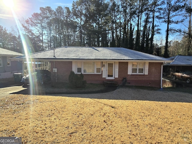 ranch-style home with a carport