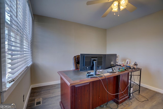 office space with ceiling fan and dark hardwood / wood-style floors