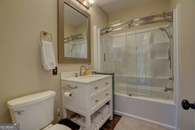 full bathroom with vanity, shower / bath combination with glass door, and toilet