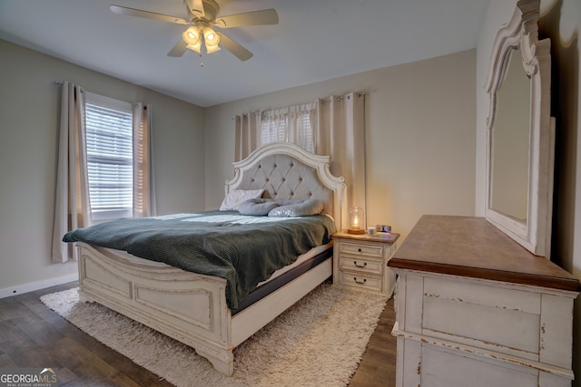 bedroom with ceiling fan and dark hardwood / wood-style flooring