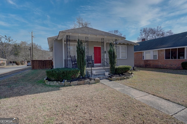 view of front facade with a porch and a front yard