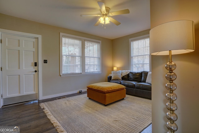 living room with ceiling fan and hardwood / wood-style floors