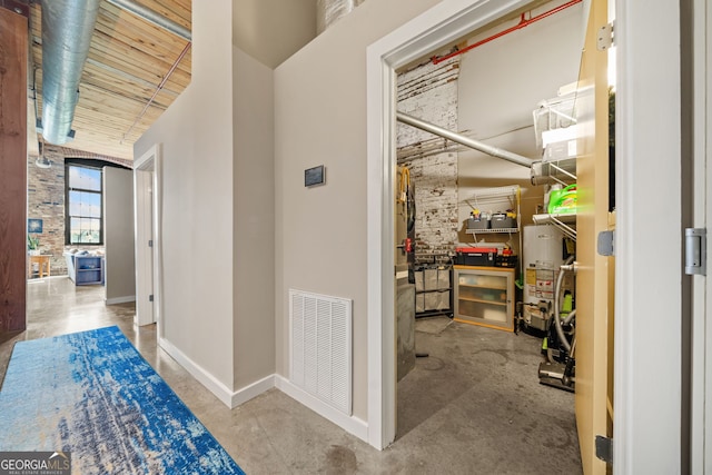 hallway with concrete flooring