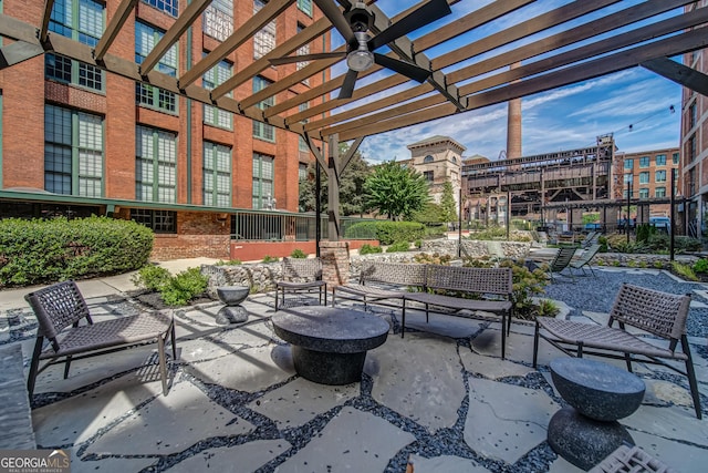 view of patio featuring ceiling fan and a pergola