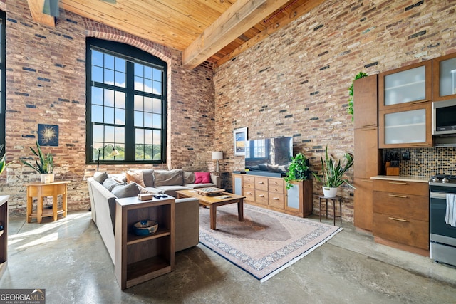 living room featuring beamed ceiling, a towering ceiling, and wooden ceiling