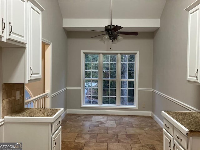 unfurnished dining area with ceiling fan