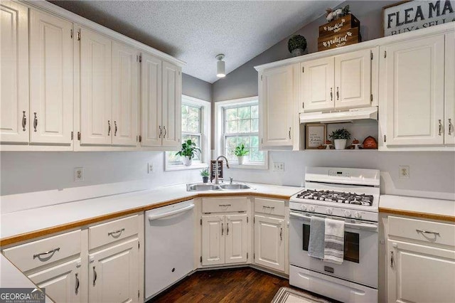 kitchen with lofted ceiling, sink, white cabinetry, a textured ceiling, and white appliances