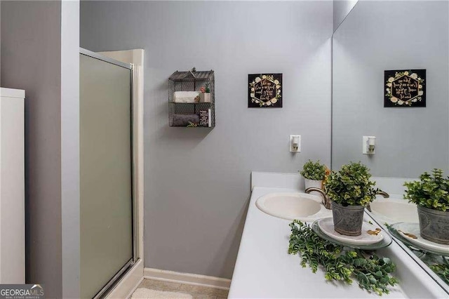 bathroom featuring vanity and a shower with shower door