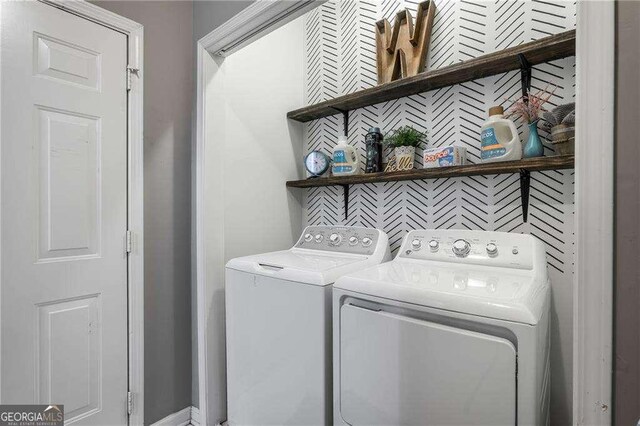 laundry room with washer and clothes dryer