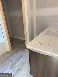 bathroom with hardwood / wood-style floors