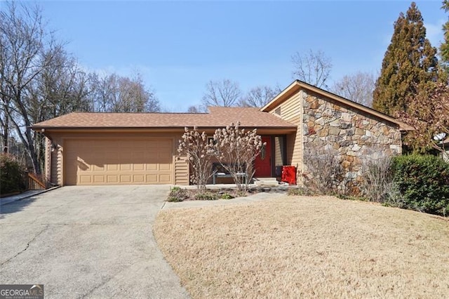 ranch-style house featuring a garage