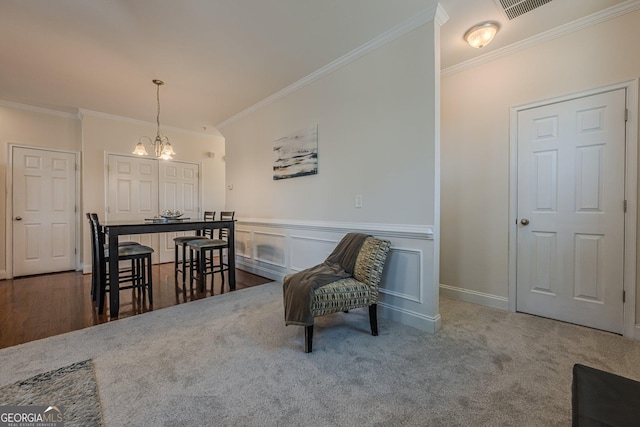 dining space with a chandelier, dark colored carpet, ornamental molding, and visible vents