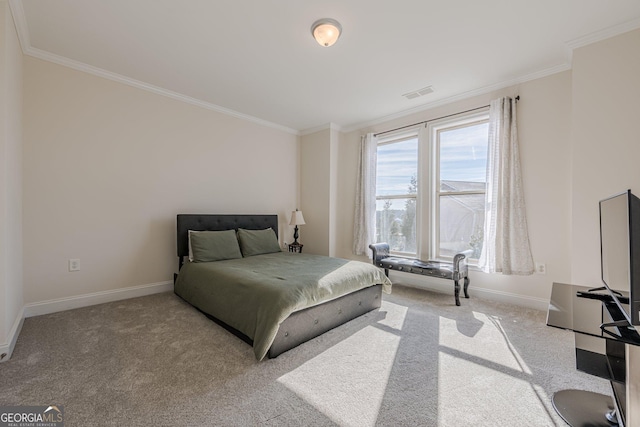 bedroom featuring ornamental molding, light colored carpet, visible vents, and baseboards