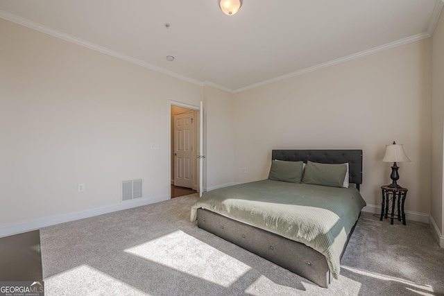 carpeted bedroom with baseboards, visible vents, and crown molding