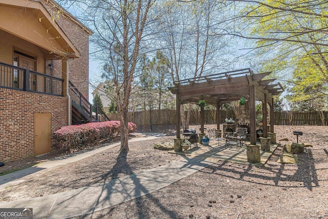 view of yard with a fenced backyard and a pergola