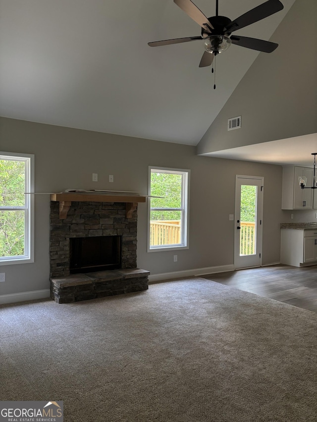 29 Iron Bound Trl, Dallas, GA 30132 - unfurnished living room featuring light colored carpet, a stone fireplace, high vaulted ceiling, and a ceiling fan