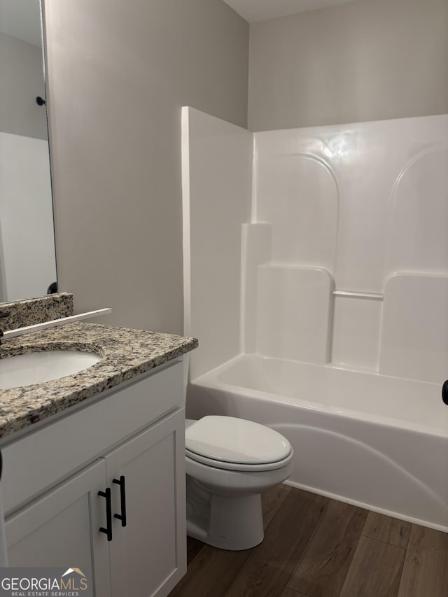 29 Iron Bound Trl, Dallas, GA 30132 - bathroom featuring wood finished floors, vanity, and bathing tub / shower combination