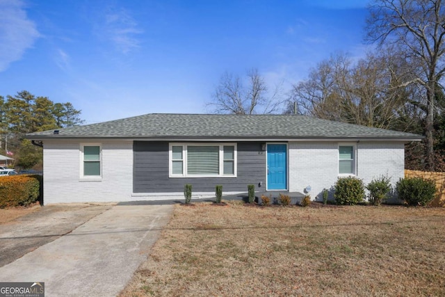 ranch-style home with a front lawn