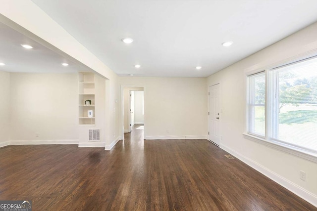 interior space with dark hardwood / wood-style floors