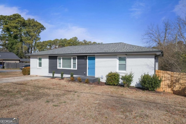 ranch-style home with a front lawn