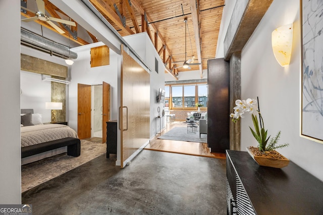 hallway featuring a high ceiling, wood ceiling, and beamed ceiling