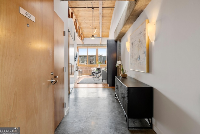 corridor with wood ceiling and beam ceiling