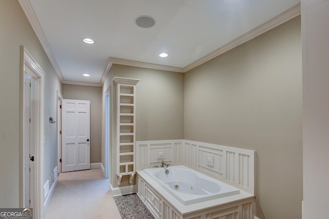 bathroom featuring a washtub and crown molding