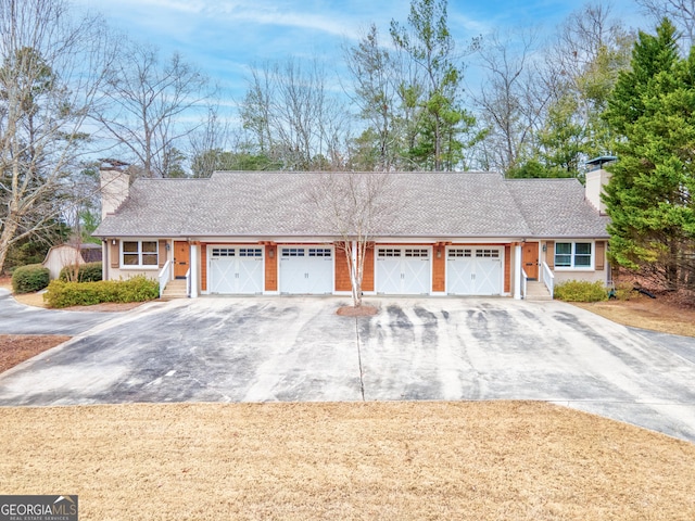 single story home featuring a garage