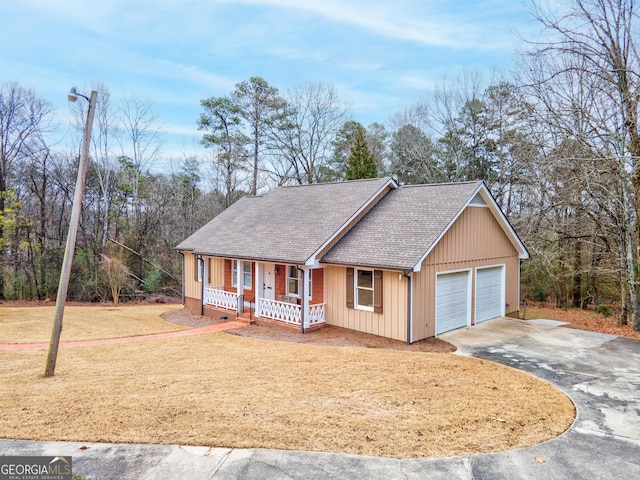 view of front of house featuring a porch and a garage