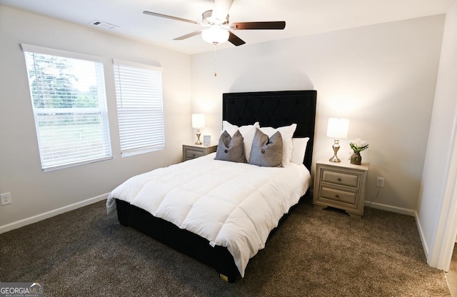 bedroom with dark carpet and ceiling fan