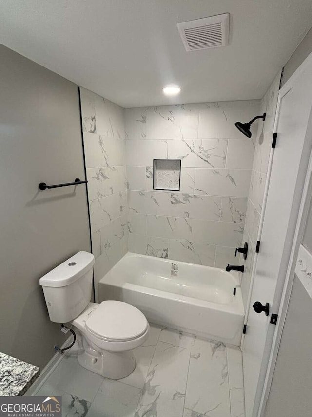 bathroom with marble finish floor, visible vents, toilet, and shower / tub combination